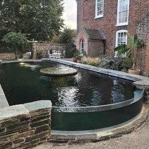 Fabulous water feature by Kent Aquatics. Using one of our reclaimed millstones as the fountain. We lo...