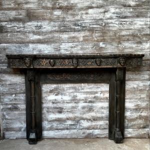 A rare & unusual gothic carved Oak fireplace, complete with various carved heads including Arthur & G...